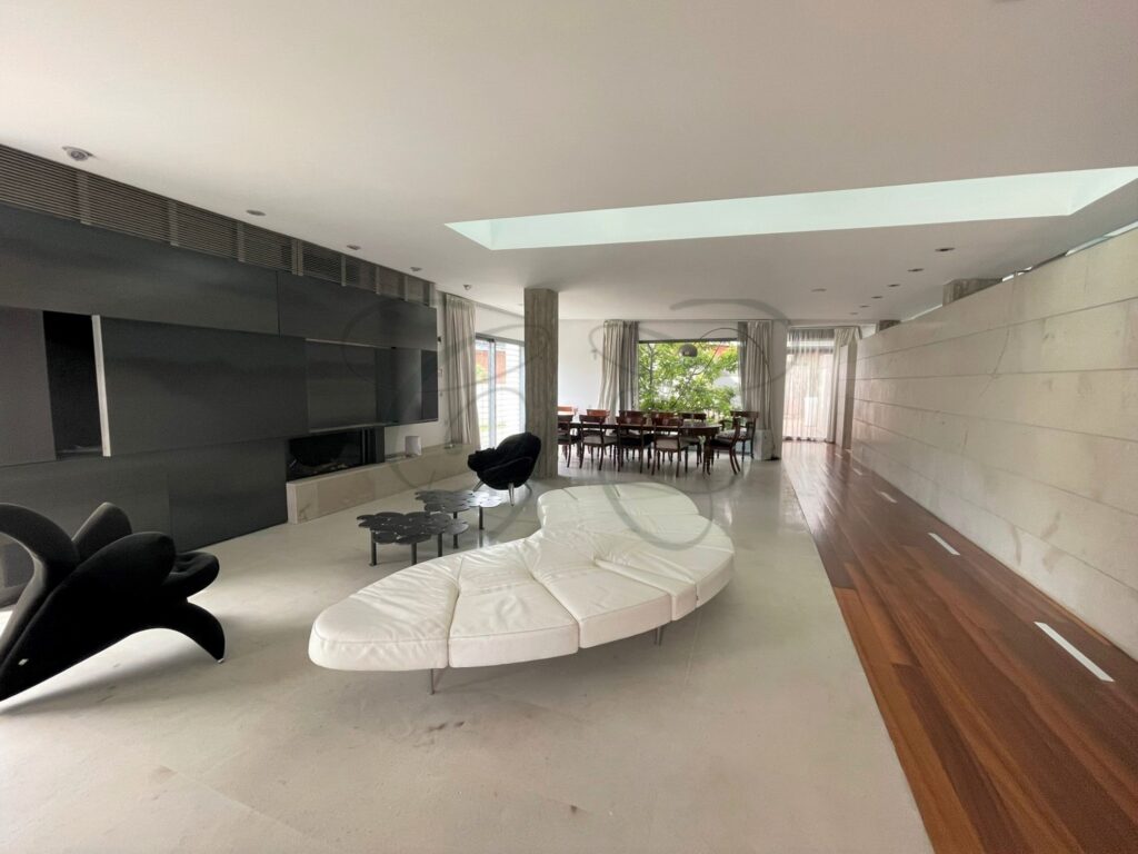 The Brutalist architectural design of a unique luxury villa for sale in Casal Palocco, Rome, by Class & Country Homes.