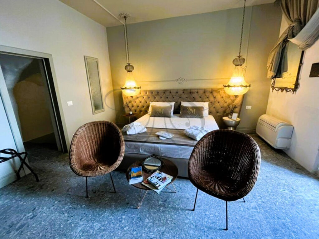 A luxuriously renovated historic dammuso for sale in Noto, showcasing a blend of old and new design.