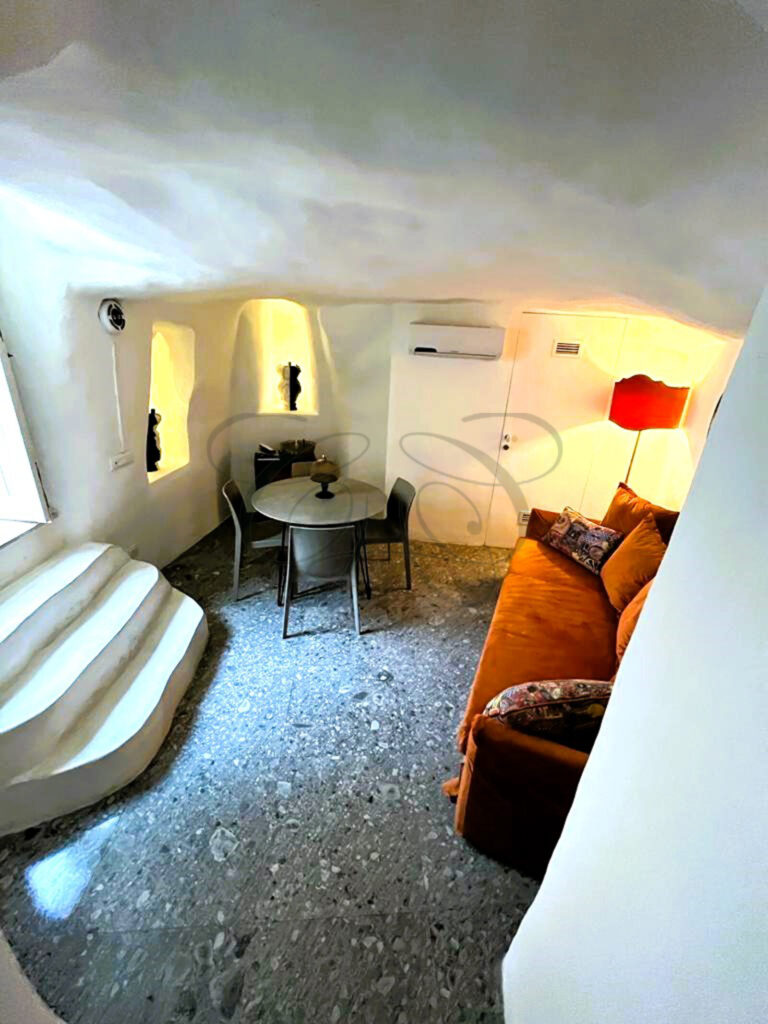The open-plan loft layout of the renovated dammuso for sale in Noto, Sicily.