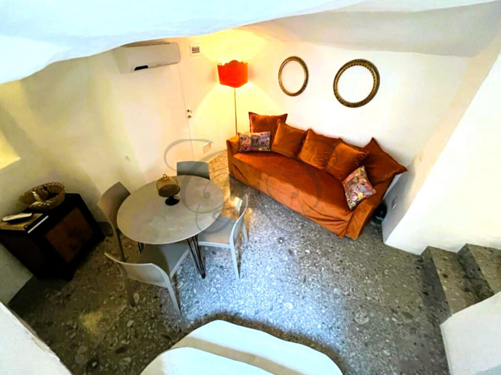 A luxuriously renovated historic dammuso for sale in Noto, showcasing a blend of old and new design.