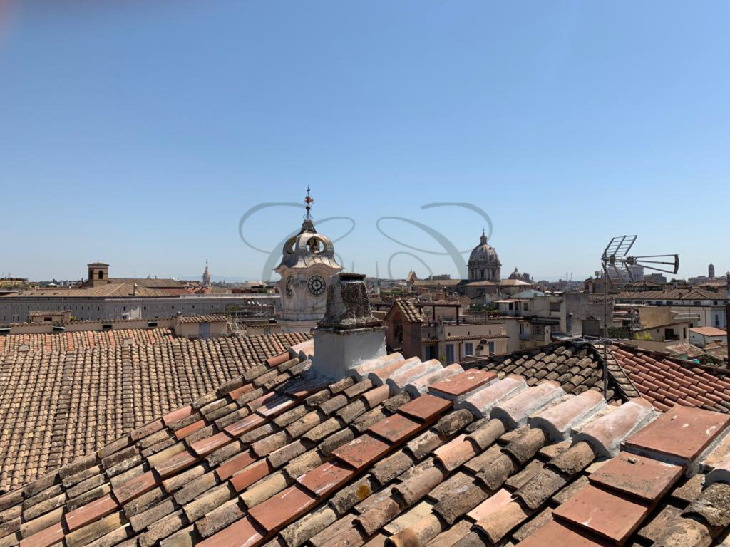 Panoramic view of Rome's rooftops, domes, and monuments from the penthouse for rent in the historic center