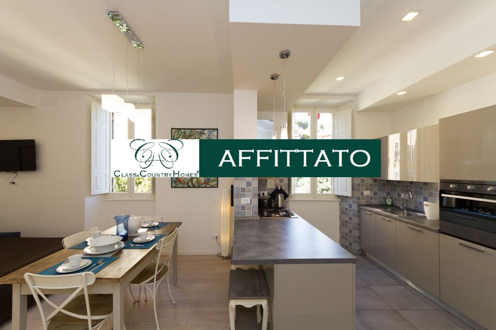 Luminoso open space con cucina e zona pranzo in appartamento affittato a Roma Nord da Class & Country Homes.