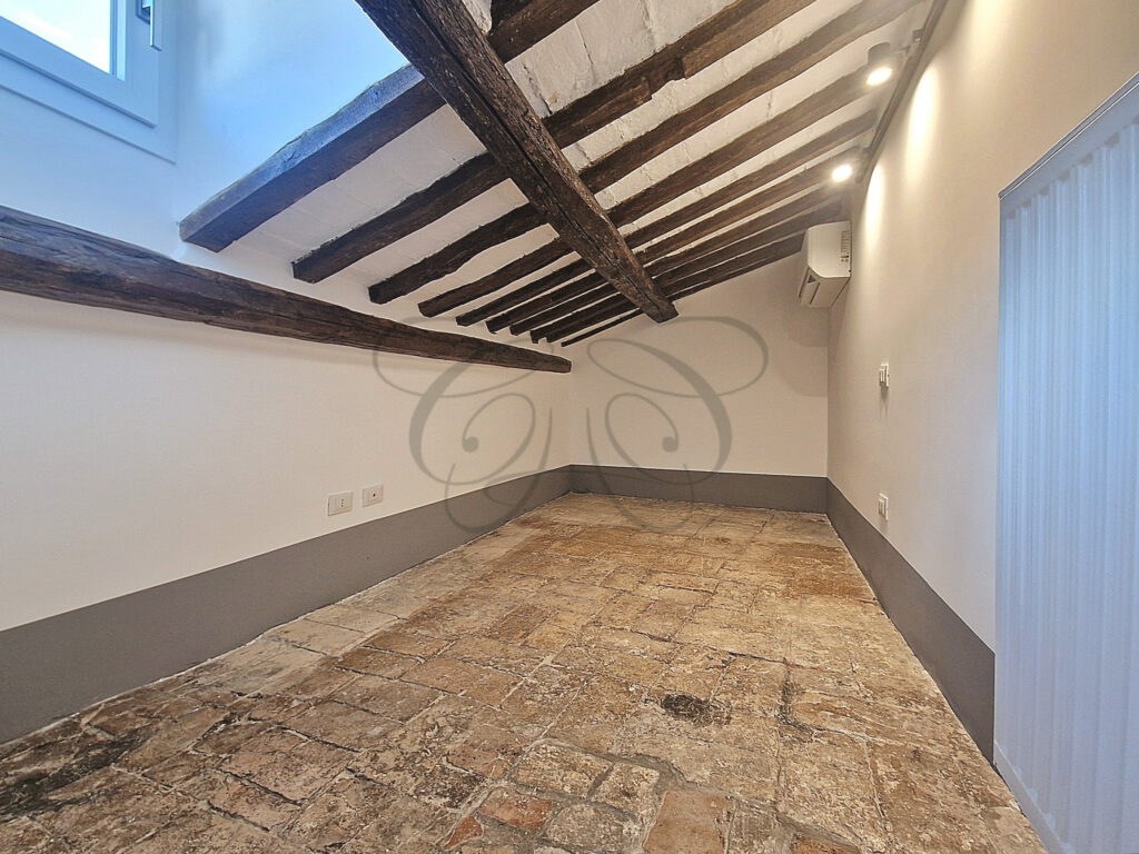 A quiet guest room/study under a sloping roof in the attic apartment for rent in Rome's historic centre