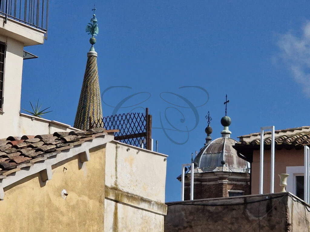 Picturesque view of historic buildings and rooftops from the renovated attic apartment for rent in Rome.