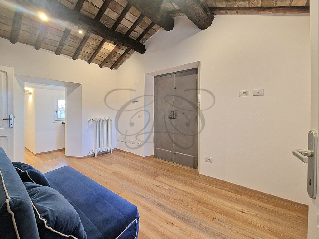 The modern, fully equipped kitchen in a newly renovated attic apartment for rent in Rome, offered by Class & Country Homes.
