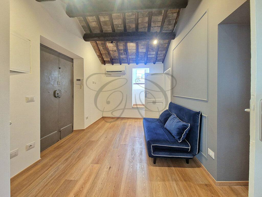 The modern, fully equipped kitchen in a newly renovated attic apartment for rent in Rome, offered by Class & Country Homes.