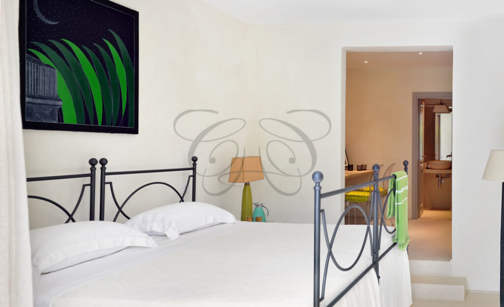 The elegant master bedroom with a four-poster bed in the luxury villa for rent in Capalbio, by Class & Country Homes.