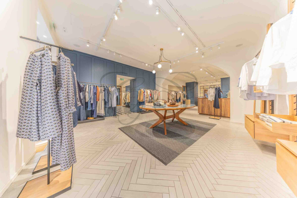 A bright luxury retail space with large display windows, an investment property for sale in Rome by Class & Country Homes.