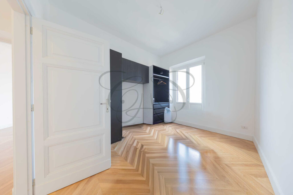 Modern bathroom with dark tiles and walk-in shower - Class & Country Homes.