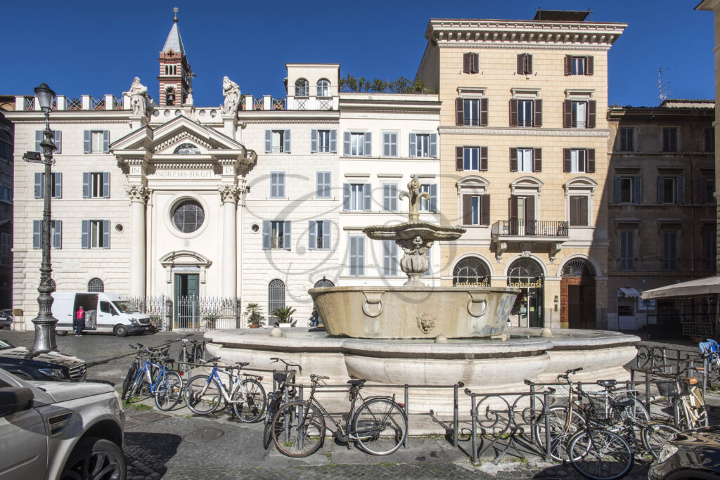 Piazza Farnese scene with bicycles and historic architecture - Class & Country Homes.