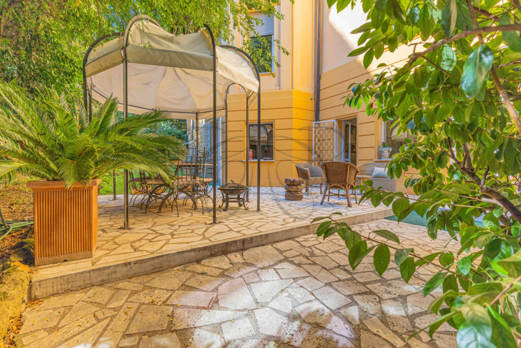 Detail of the historic villino's exterior wall and patio - Class & Country Homes.
