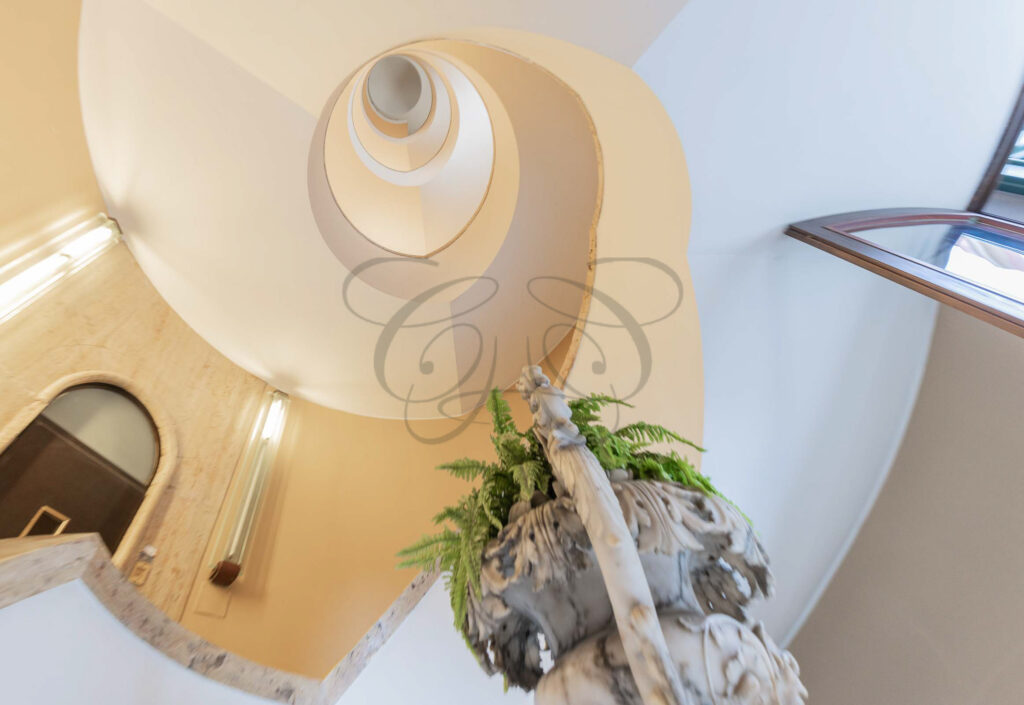 The landing of the spiral staircase in the historic villa - Class & Country Homes.