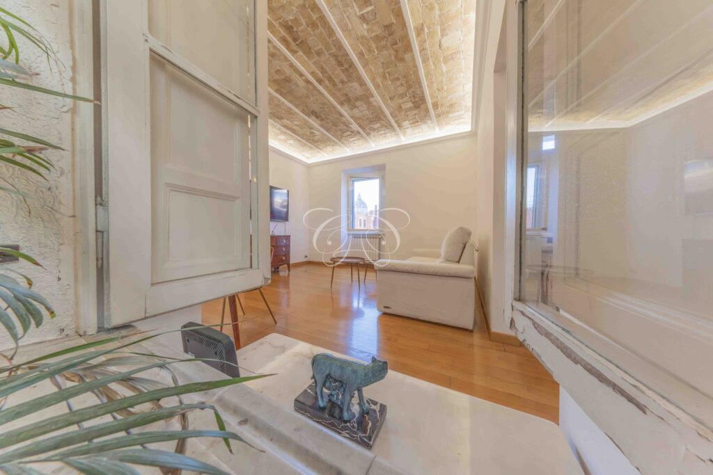 Let luxury apartment Borgo Vittorio Rome — living room seen from the gallery
