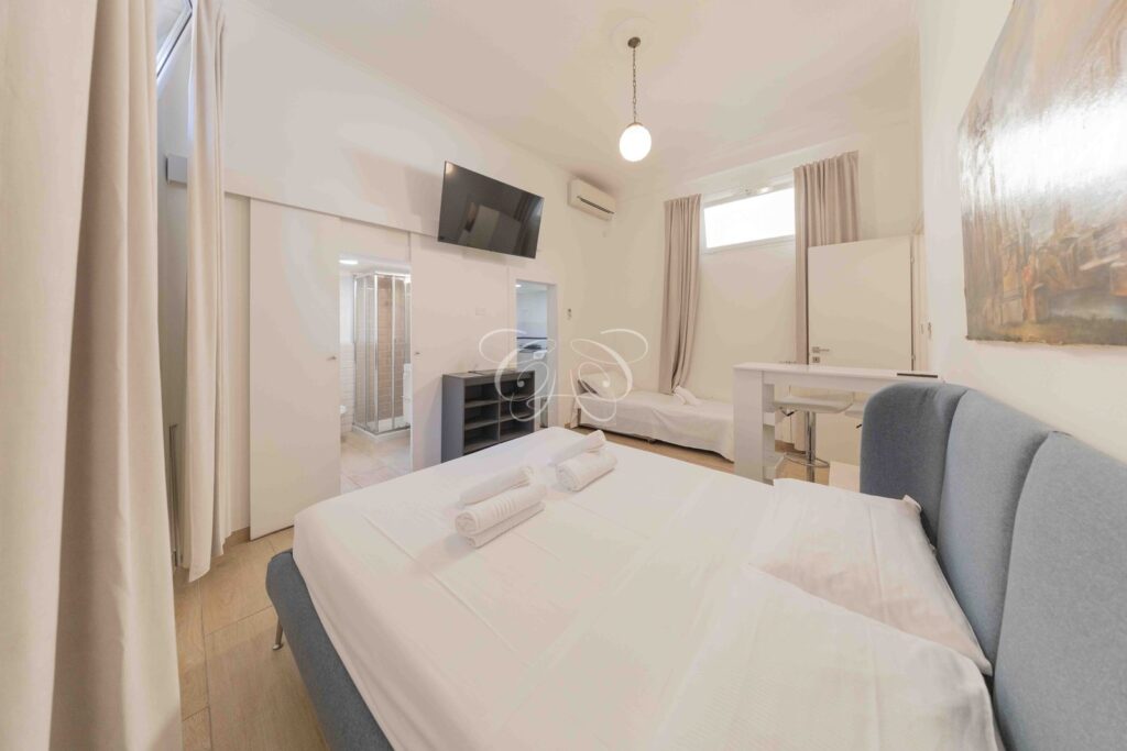 Prati Rome apartment for sale investment — main room towards bathroom and kitchen